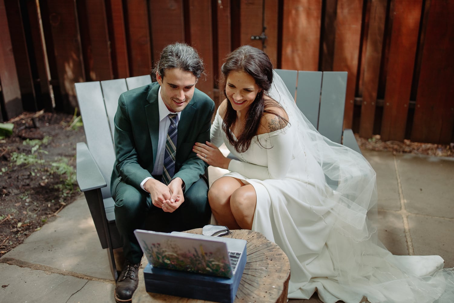Bride and Groom Talking to Family on Zoom on Their Elopement Day