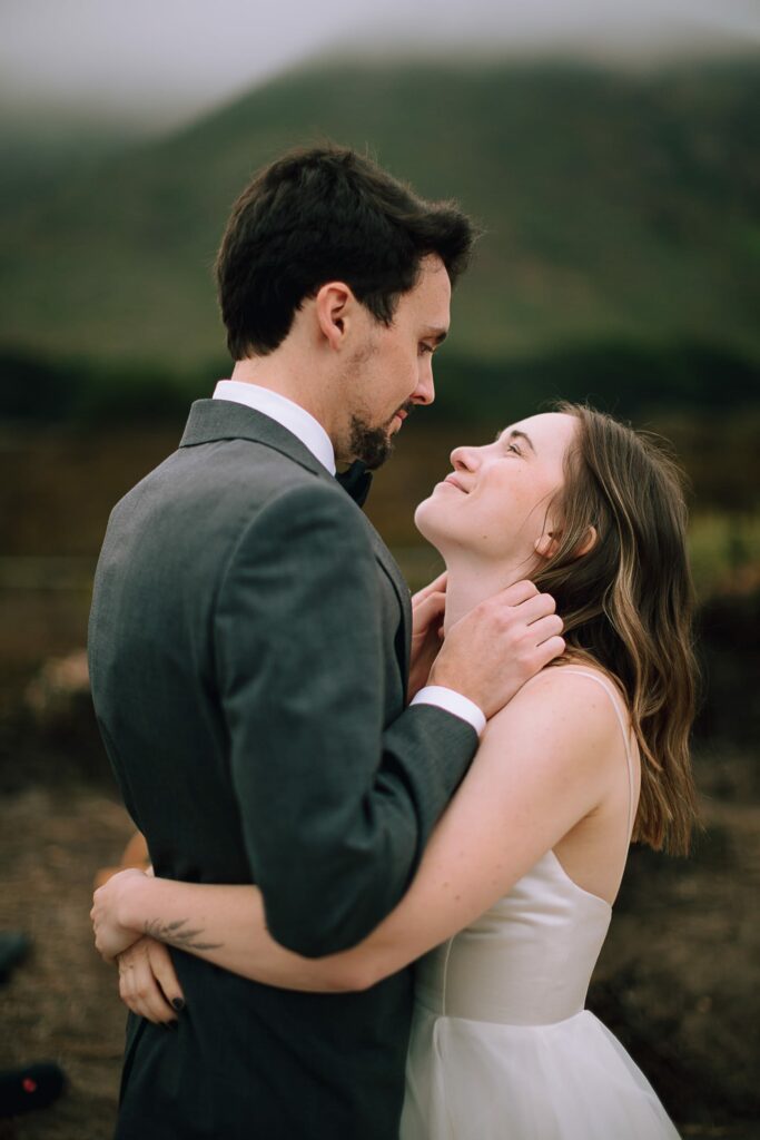 Couple embracing on wedding day in Big Sur