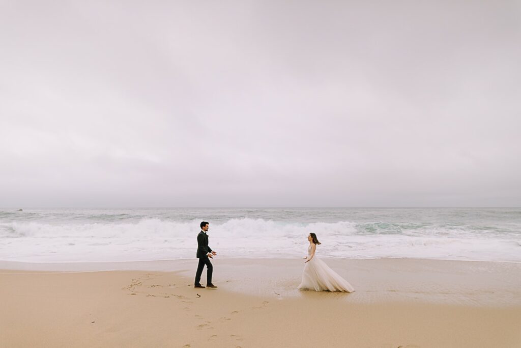Couple eloping on a foggy beach in Big Sur