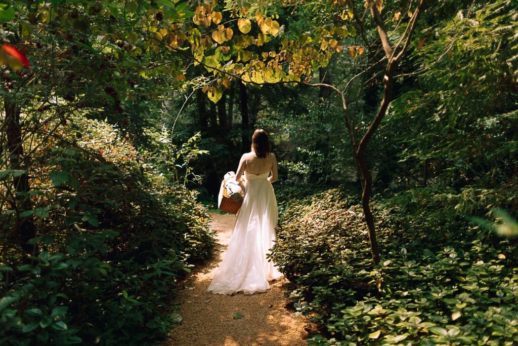Light shining through the Big Sur forest on a beautiful bride